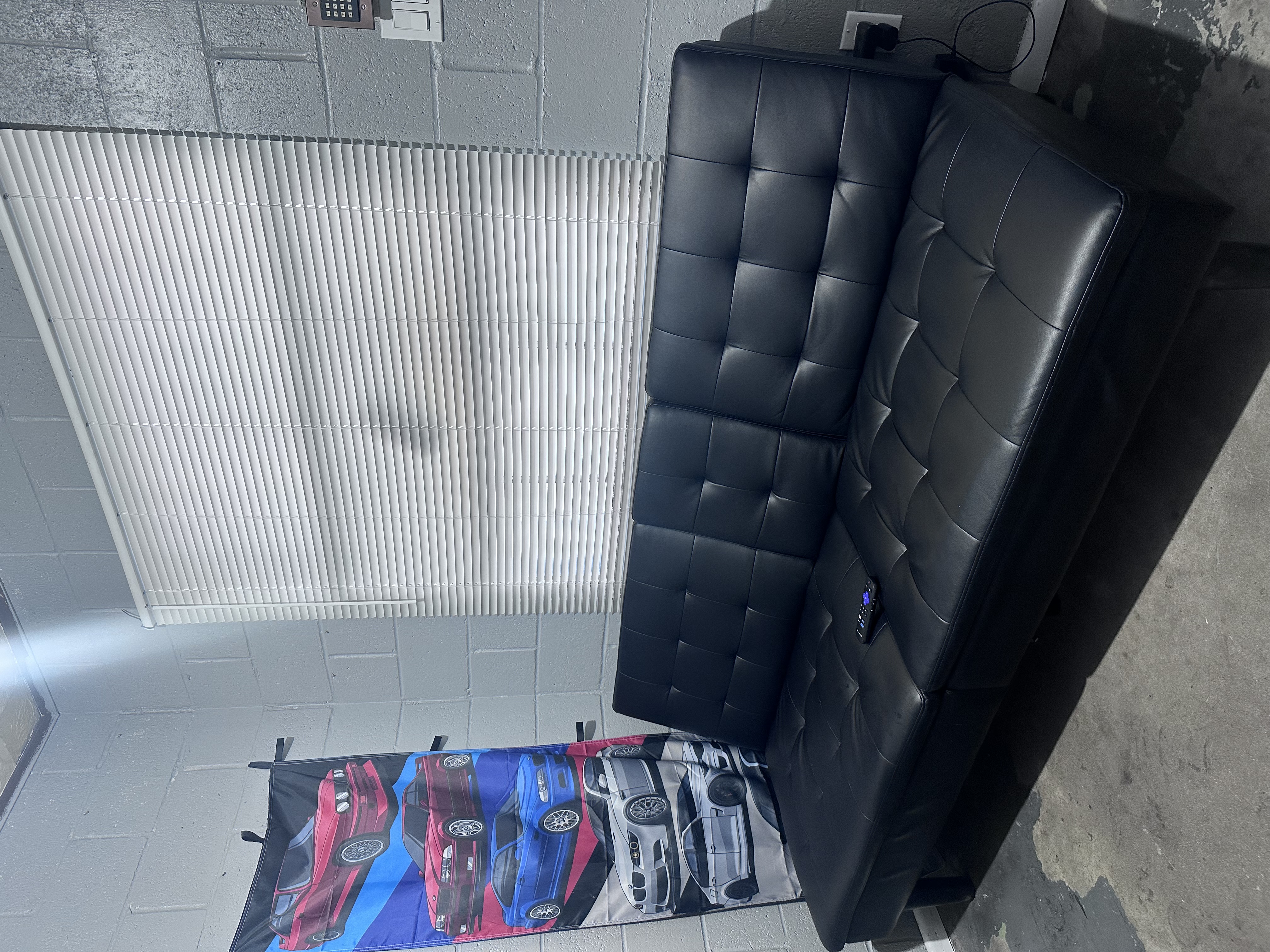 Our actual comfortable customer waiting area with seating and refreshments