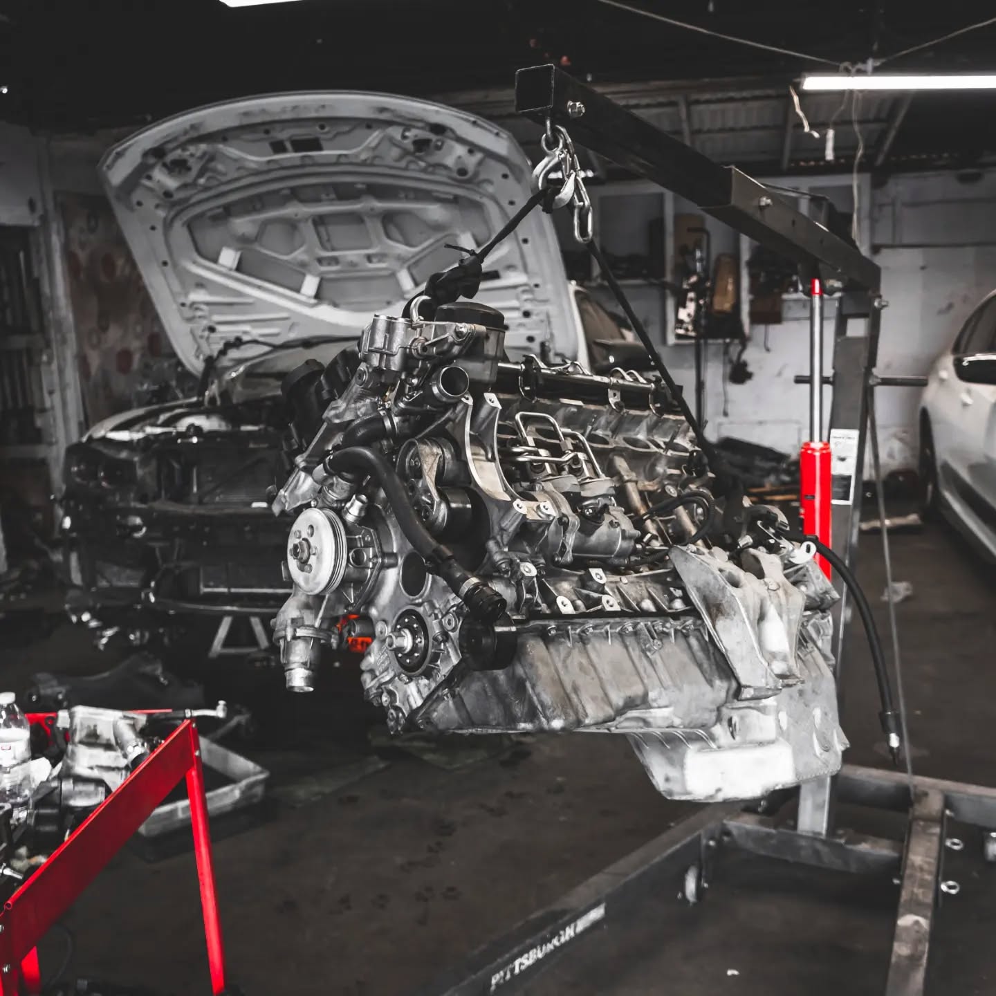BMW engine work in progress showing detailed engine service