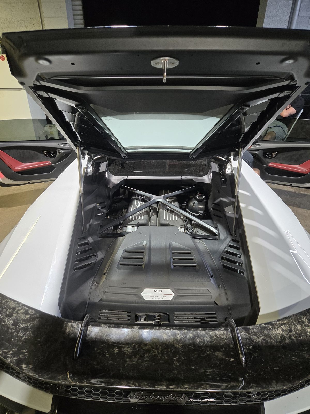Lamborghini Huracan V10 engine bay with forged carbon rear wing